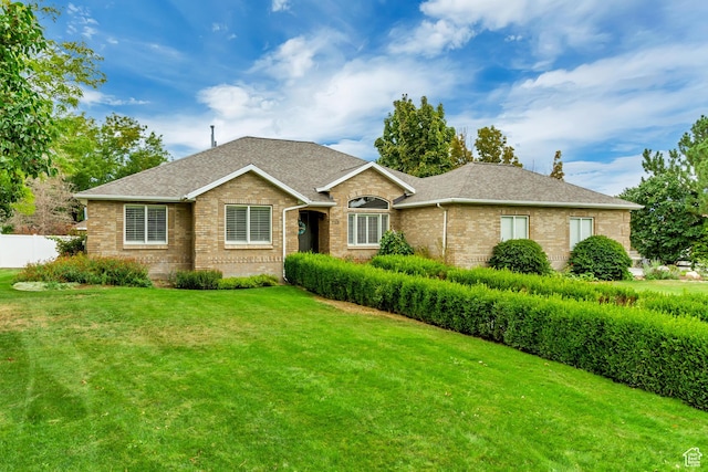 2768 W Country Classic Dr, Bluffdale, UT 84065 - ranch-style house with roof with shingles, brick siding, fence, and a front lawn