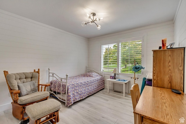 2768 W Country Classic Dr, Bluffdale, UT 84065 - bedroom featuring light wood-style floors, an inviting chandelier, and wooden walls