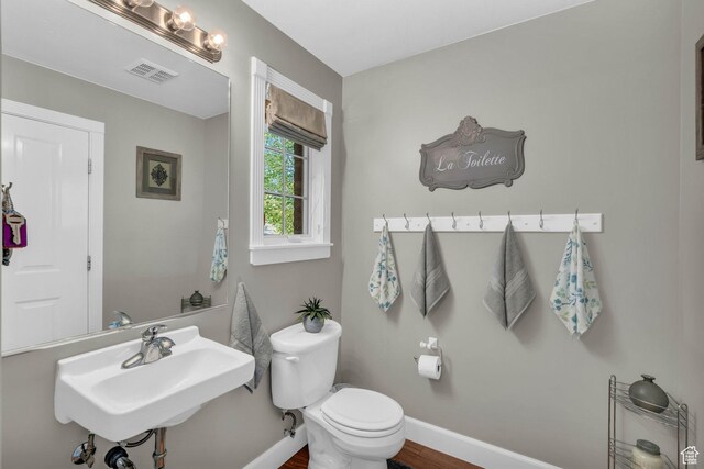 2218 W 2575 N, Cedar City, UT 84721 - bathroom with visible vents, toilet, a sink, wood finished floors, and baseboards