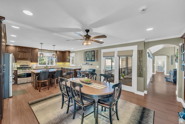 2218 W 2575 N, Cedar City, UT 84721 - dining area featuring baseboards, arched walkways, ornamental molding, wood finished floors, and recessed lighting