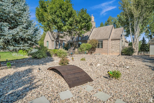 2218 W 2575 N, Cedar City, UT 84721 - rear view of property featuring a chimney and brick siding