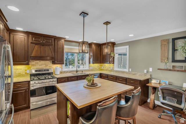 2218 W 2575 N, Cedar City, UT 84721 - kitchen with a kitchen island, custom exhaust hood, stainless steel appliances, pendant lighting, and a sink