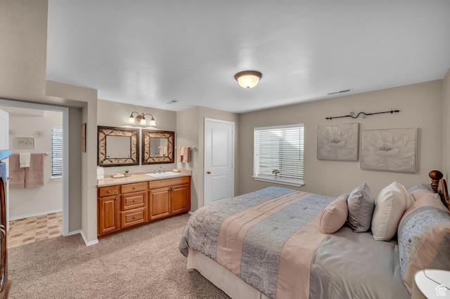 2218 W 2575 N, Cedar City, UT 84721 - bedroom featuring light colored carpet, visible vents, a sink, ensuite bath, and baseboards