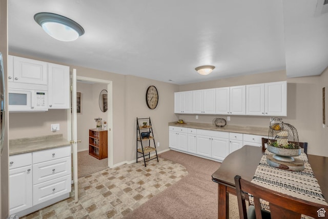 2218 W 2575 N, Cedar City, UT 84721 - kitchen with light countertops, white microwave, white cabinetry, and baseboards