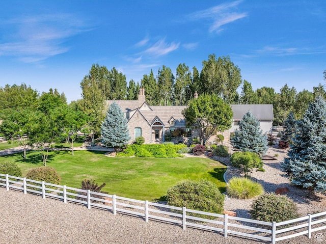 2218 W 2575 N, Cedar City, UT 84721 - view of front facade with a chimney, fence, a front lawn, and a rural view