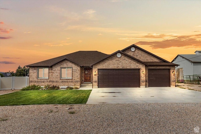 ranch-style house featuring fence, driveway, a garage, and brick siding