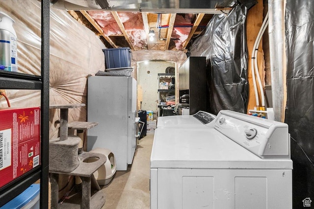 washroom with laundry area and washer and dryer