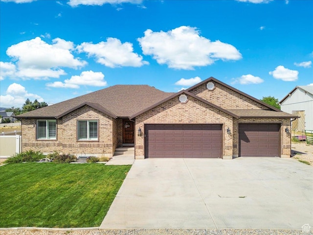 single story home featuring a front lawn, driveway, a garage, and brick siding