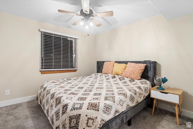carpeted bedroom featuring baseboards and ceiling fan