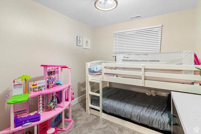 bedroom featuring baseboards, visible vents, and carpet