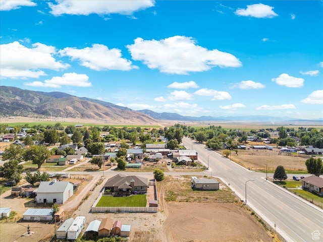 birds eye view of property featuring a mountain view and a residential view