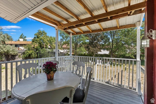 wooden deck featuring outdoor dining area