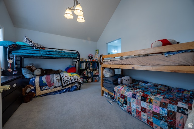 carpeted bedroom with high vaulted ceiling