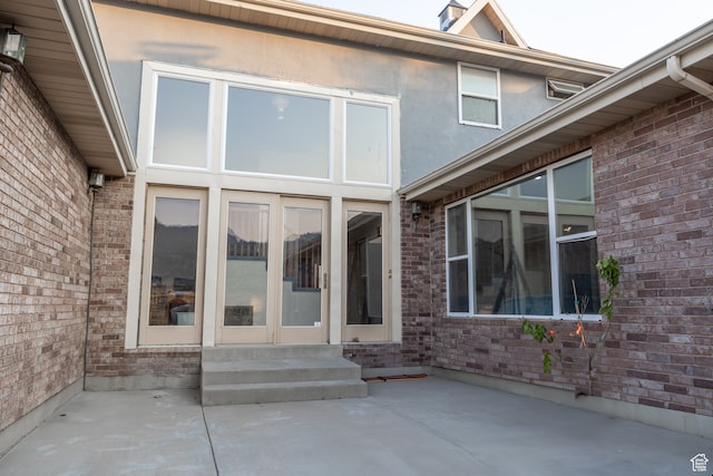 doorway to property featuring a patio