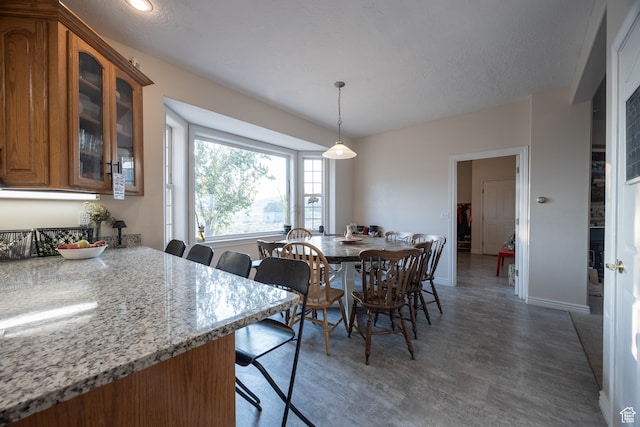 dining space with a textured ceiling