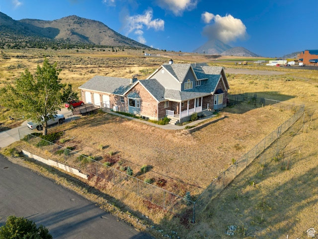 drone / aerial view featuring a mountain view and a rural view
