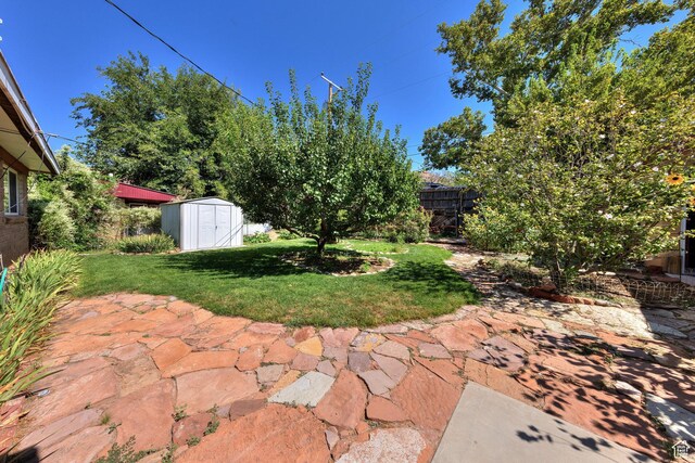 343 S Tusher St, Moab, UT 84532 - view of patio / terrace with a shed, an outdoor structure, and fence