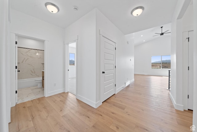 678 S Todd Ct, Grantsville, UT 84029 - corridor with baseboards, lofted ceiling, and light wood-style flooring