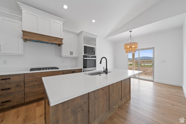 678 S Todd Ct, Grantsville, UT 84029 - kitchen with black cooktop, white cabinets, a sink, stainless steel oven, and custom exhaust hood