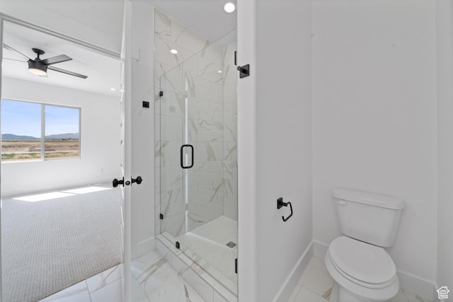 678 S Todd Ct, Grantsville, UT 84029 - full bathroom with a ceiling fan, toilet, a marble finish shower, baseboards, and a mountain view