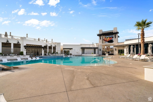 pool with a patio area