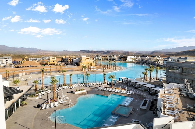 view of swimming pool featuring a mountain view
