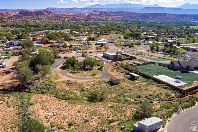 birds eye view of property with a mountain view
