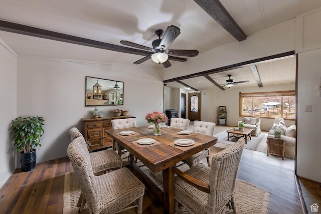 dining room with beam ceiling, a ceiling fan, and wood finished floors