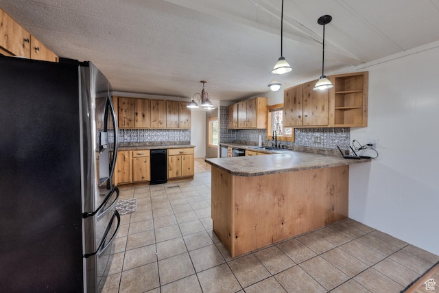 kitchen featuring stainless steel fridge with ice dispenser, light tile patterned floors, a sink, a peninsula, and decorative backsplash