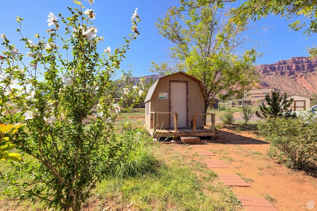 view of shed with a mountain view