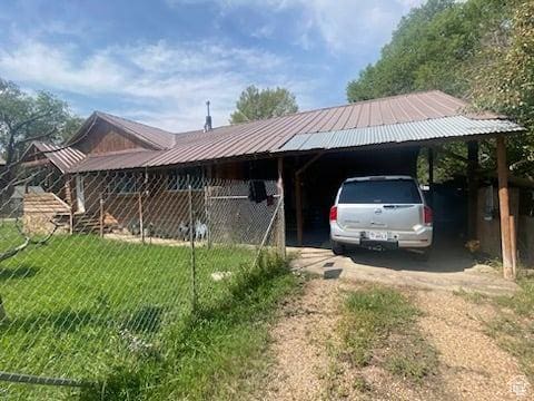 215 W 200 S, Duchesne, UT 84021 - view of front of property with a carport, metal roof, a front yard, and driveway