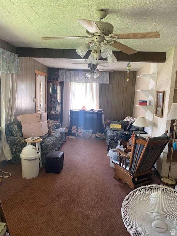 215 W 200 S, Duchesne, UT 84021 - sitting room featuring wood walls, ceiling fan, and carpet floors