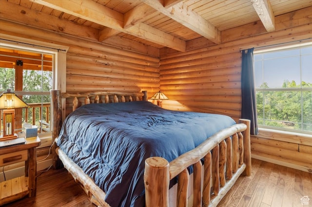 14775 N 12565 E 66&67, Mount Pleasant, UT 84647 - bedroom with multiple windows, wooden ceiling, log walls, and hardwood / wood-style flooring