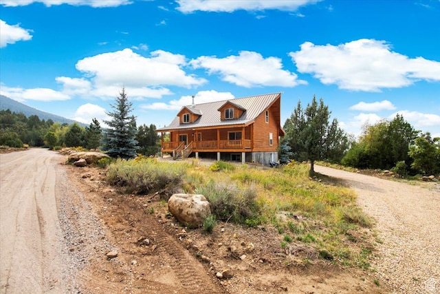 14775 N 12565 E 66&67, Mount Pleasant, UT 84647 - view of front of house with a porch, driveway, and metal roof