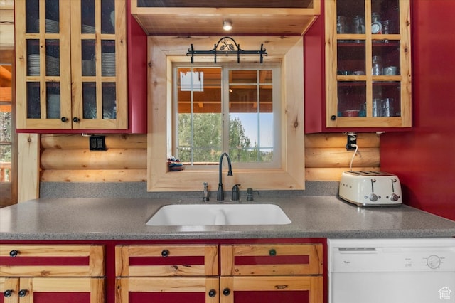 14775 N 12565 E 66&67, Mount Pleasant, UT 84647 - kitchen with dark countertops, glass insert cabinets, white dishwasher, rustic walls, and a sink