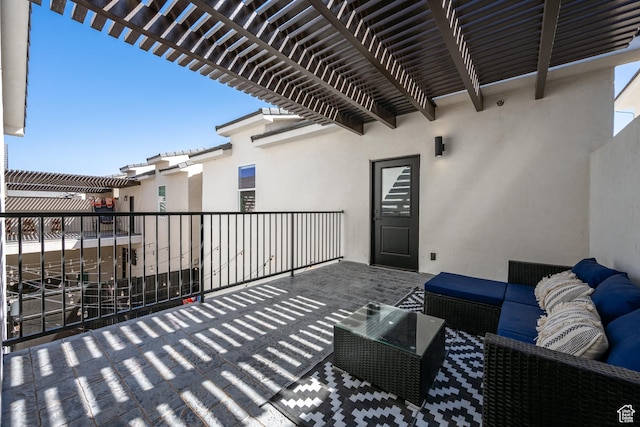 view of patio / terrace with an outdoor hangout area, a pergola, and a balcony