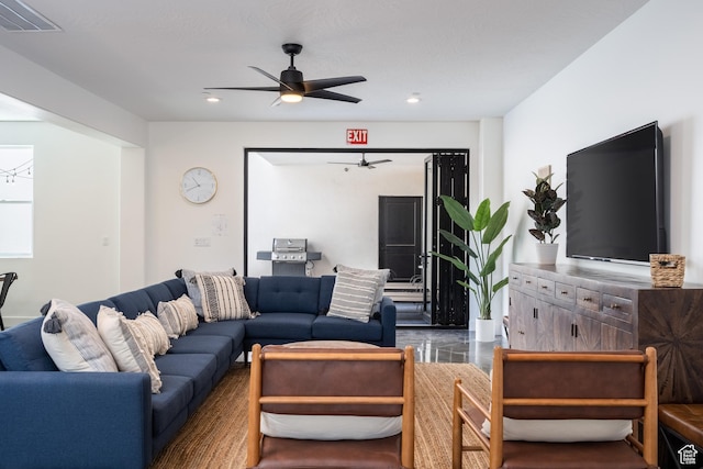 living room featuring recessed lighting, ceiling fan, and visible vents