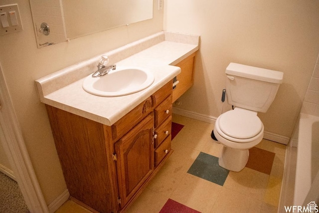 14112 S Senior Band Rd, Draper, UT 84020 - bathroom with toilet, vanity, a bathtub, and baseboards