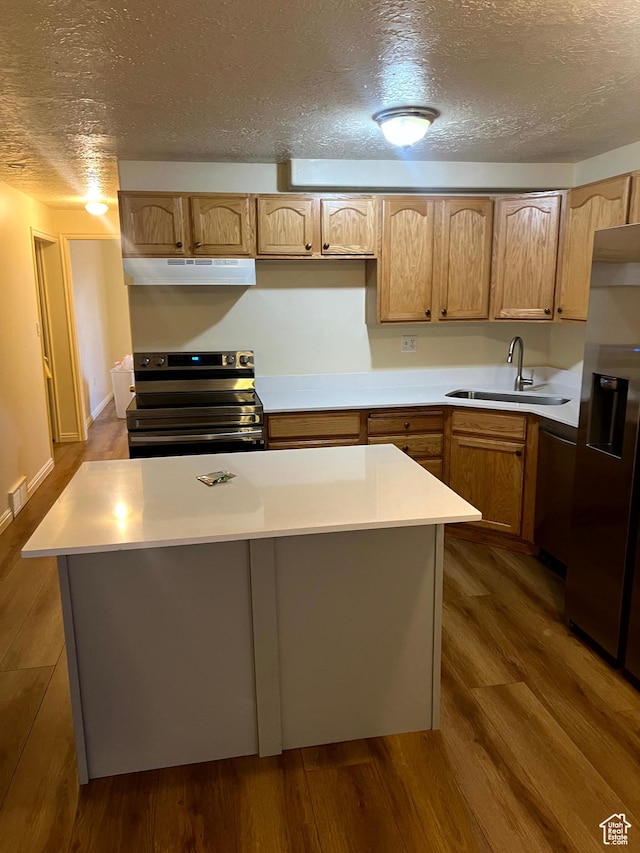 14112 S Senior Band Rd, Draper, UT 84020 - kitchen featuring light countertops, a sink, dark wood finished floors, under cabinet range hood, and stainless steel appliances