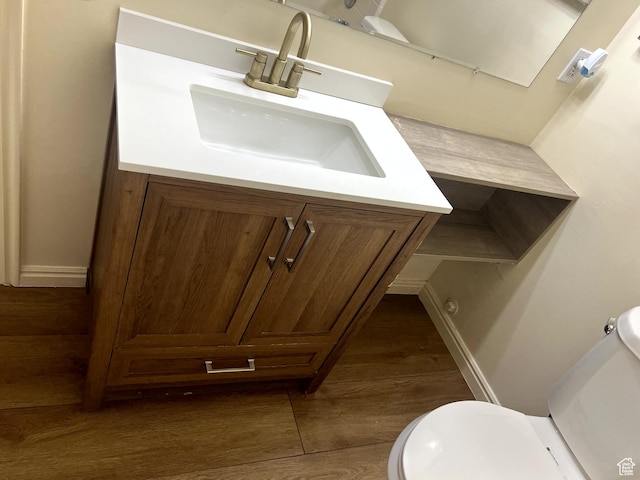 14112 S Senior Band Rd, Draper, UT 84020 - half bathroom featuring baseboards, wood finished floors, toilet, and vanity