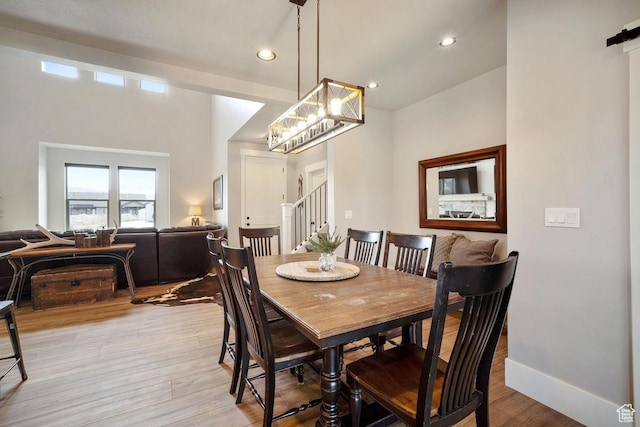 1806 S Summit Haven Dr Unit 1, Francis, UT 84036 - dining area featuring recessed lighting, light wood-style flooring, stairs, and an inviting chandelier