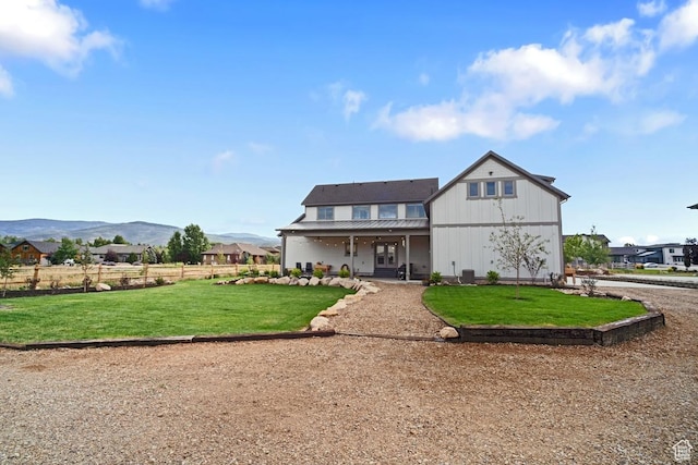 1806 S Summit Haven Dr Unit 1, Francis, UT 84036 - rear view of property with a lawn, fence, metal roof, and a mountain view