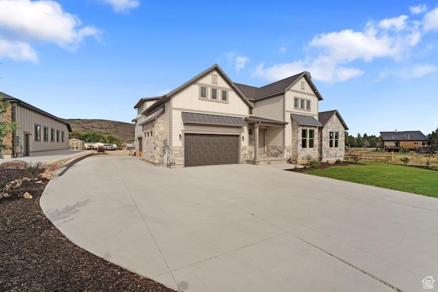 1806 S Summit Haven Dr Unit 1, Francis, UT 84036 - modern farmhouse style home with a standing seam roof, stone siding, concrete driveway, metal roof, and board and batten siding