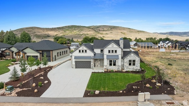 1806 S Summit Haven Dr Unit 1, Francis, UT 84036 - view of front of property featuring a standing seam roof, stone siding, metal roof, concrete driveway, and a front yard