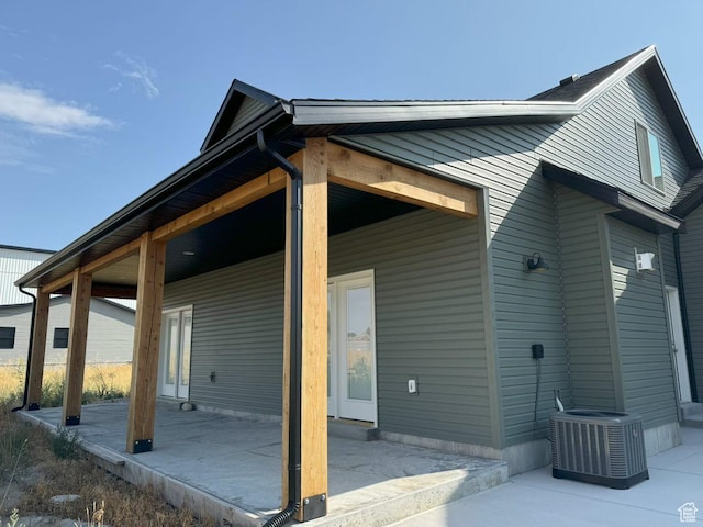 view of property exterior featuring a patio and central air condition unit