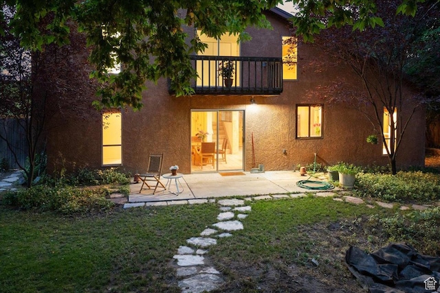 2328 W 300 N, Provo, UT 84601 - rear view of house with a patio area, stucco siding, a lawn, and a balcony