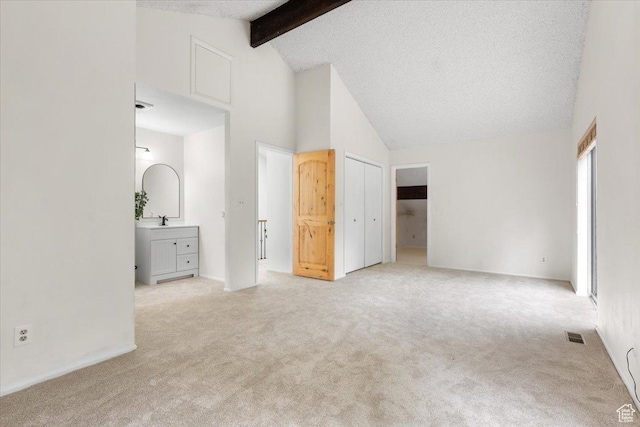 2328 W 300 N, Provo, UT 84601 - unfurnished bedroom with beam ceiling, a textured ceiling, high vaulted ceiling, and carpet floors