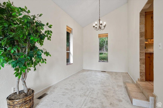 2328 W 300 N, Provo, UT 84601 - unfurnished room with a chandelier, visible vents, lofted ceiling, and carpet floors