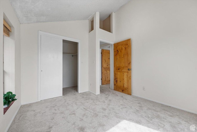 2328 W 300 N, Provo, UT 84601 - unfurnished bedroom featuring high vaulted ceiling, carpet, a closet, and a textured ceiling