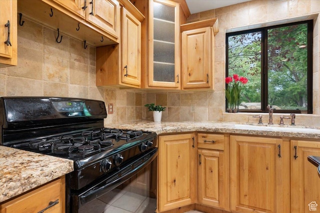 2328 W 300 N, Provo, UT 84601 - kitchen with tasteful backsplash, black range with gas stovetop, glass insert cabinets, and a sink